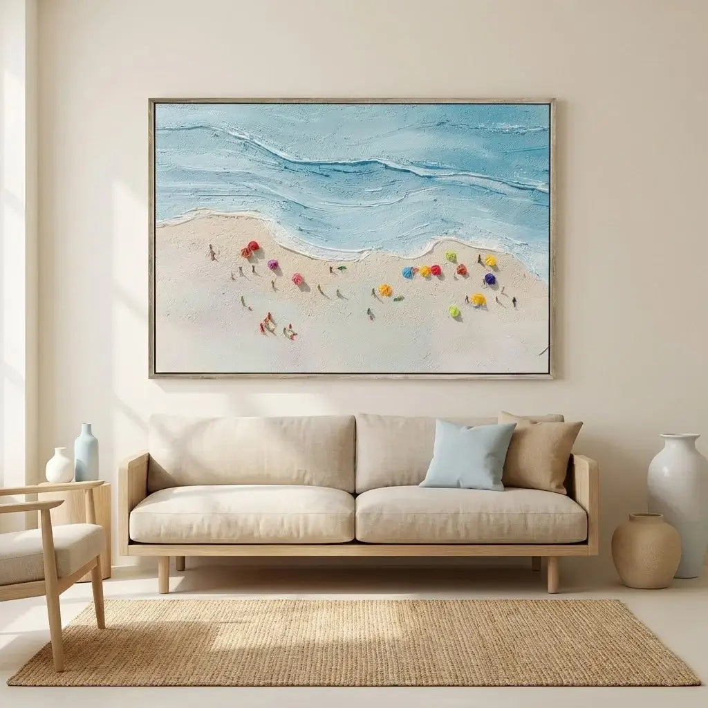 Living room with a beige sofa, rug, and wall art of a beach scene.