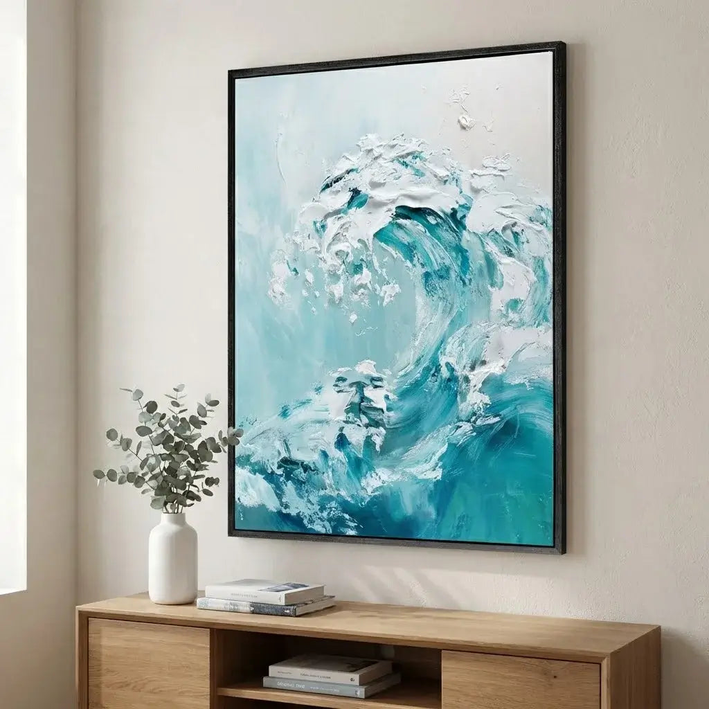 Framed abstract artwork of a wave on a wall above a wooden console table.