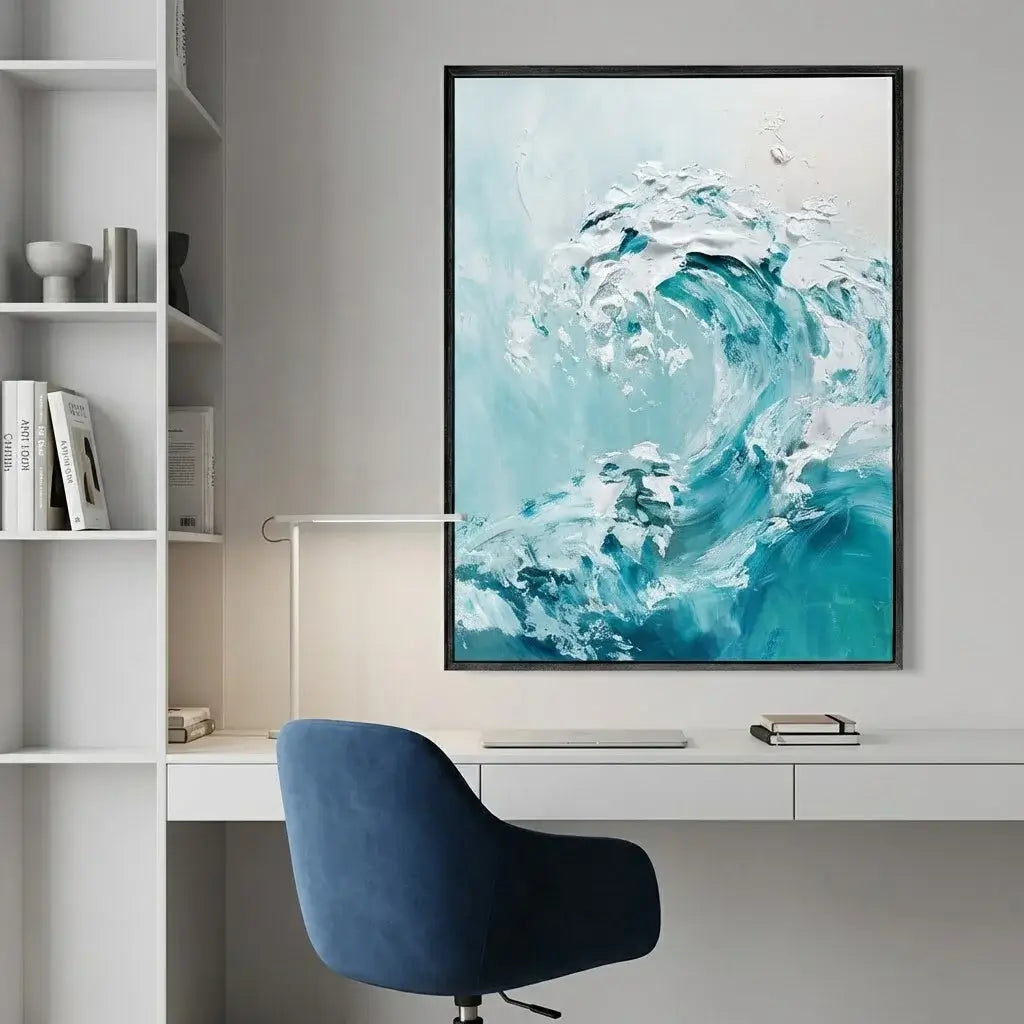 Framed abstract artwork of a wave in a modern office setting with a blue chair and white shelves.