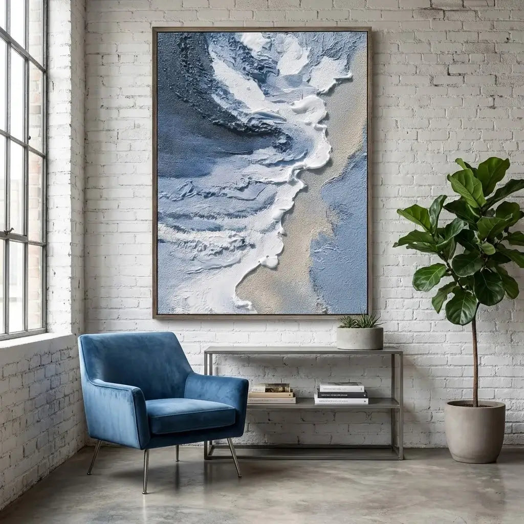 Modern interior with a blue armchair, abstract art, and a plant.