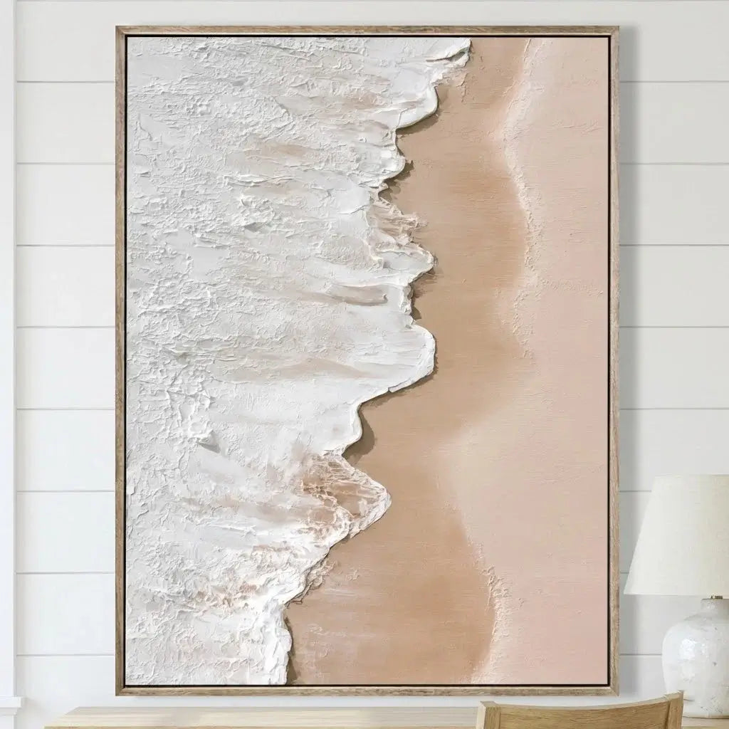 Abstract art piece with beige and white colors on a wooden frame, hanging on a white wall.