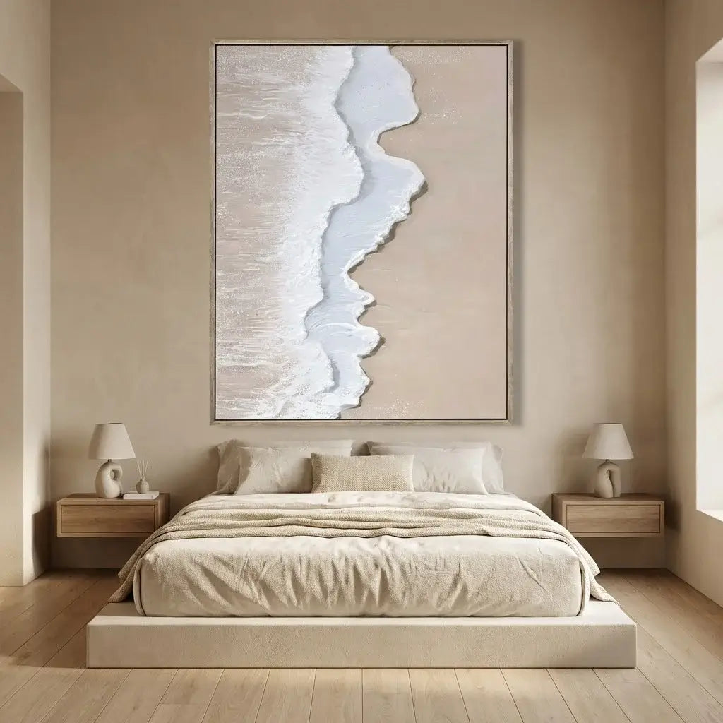 Beige bedroom with a bed, nightstands, and abstract wall art.