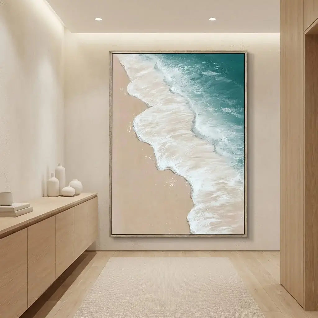Framed artwork of a beach scene in a modern interior setting.