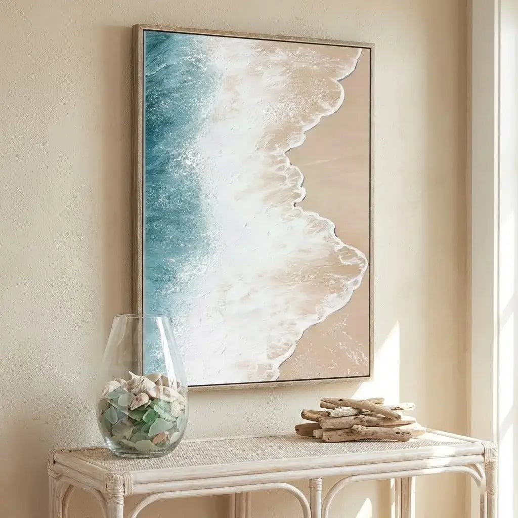 Framed abstract artwork on a wall above a white console table with decorative items.