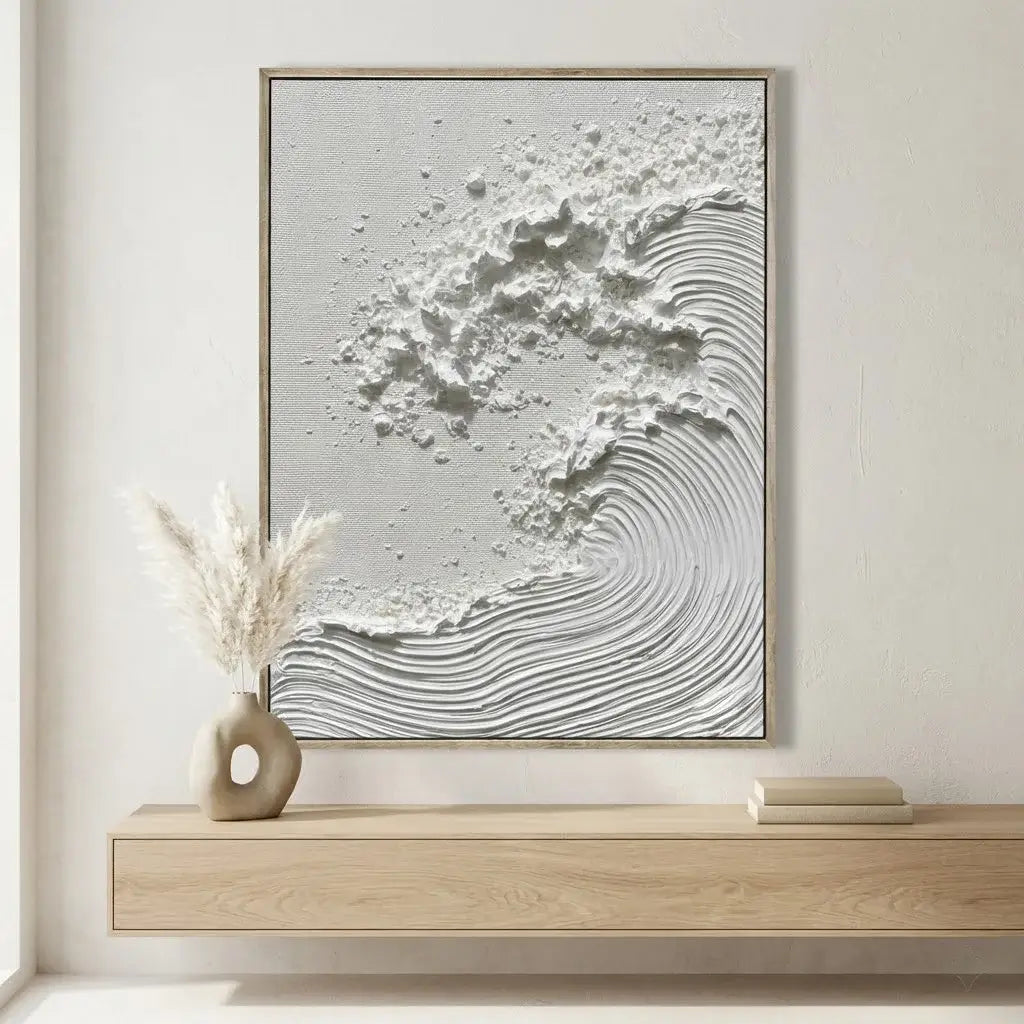 Framed abstract artwork on a wall above a wooden console table.