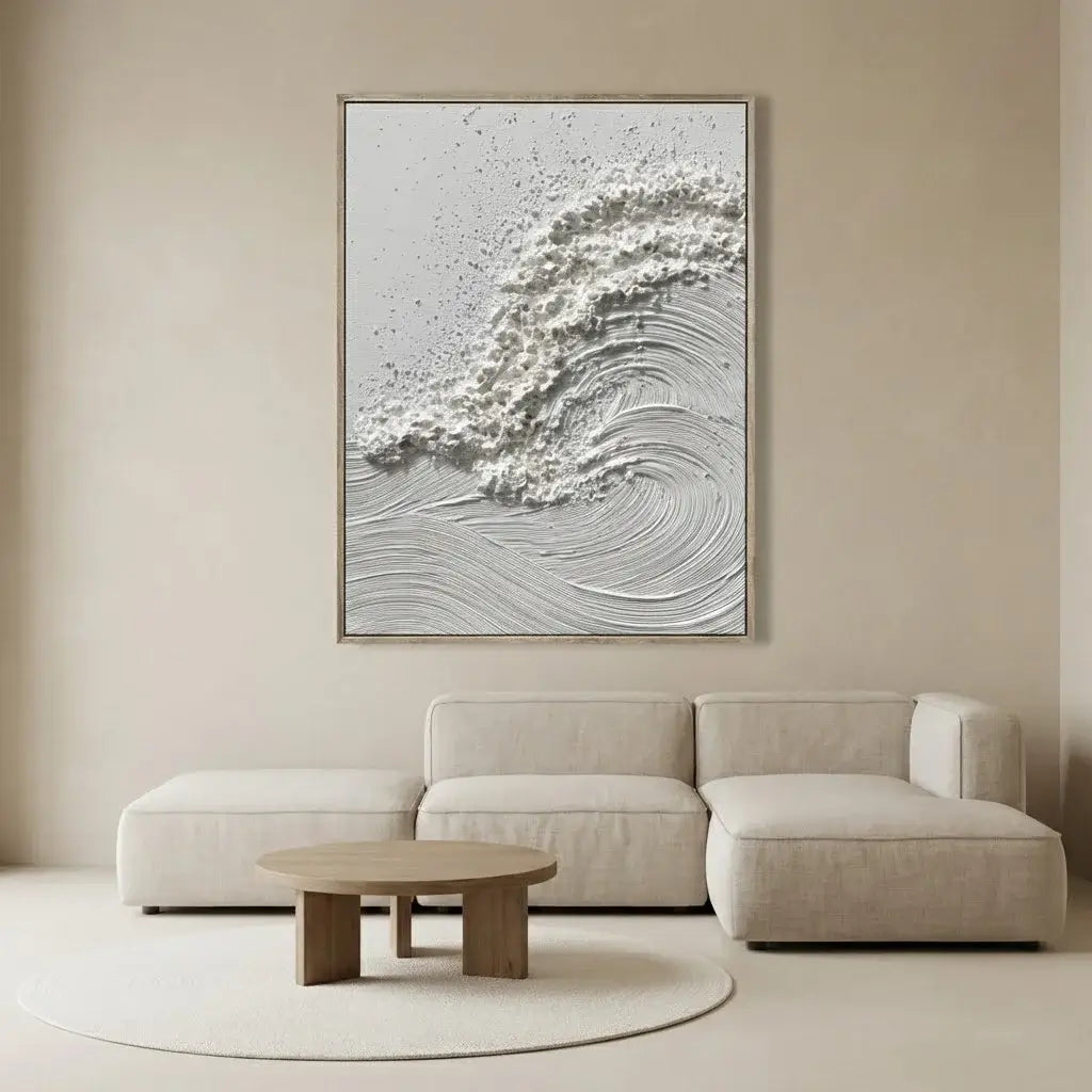 Beige sofa in a room with a large abstract painting on the wall.