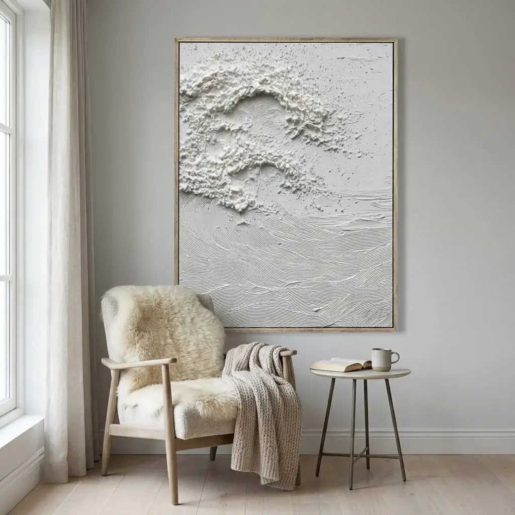 Modern interior with a textured wall art piece above a chair.