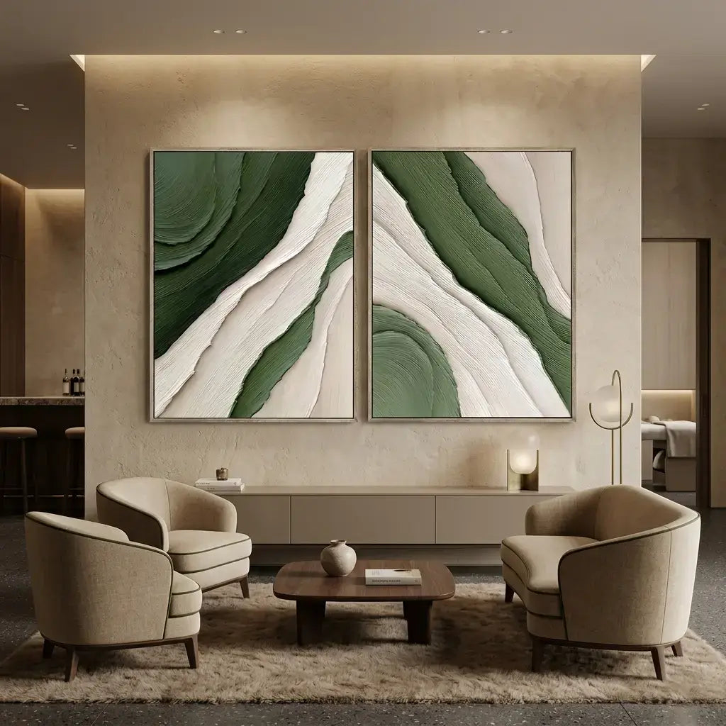 Modern living room with abstract green and beige wall art, beige armchairs, and a wooden coffee table.