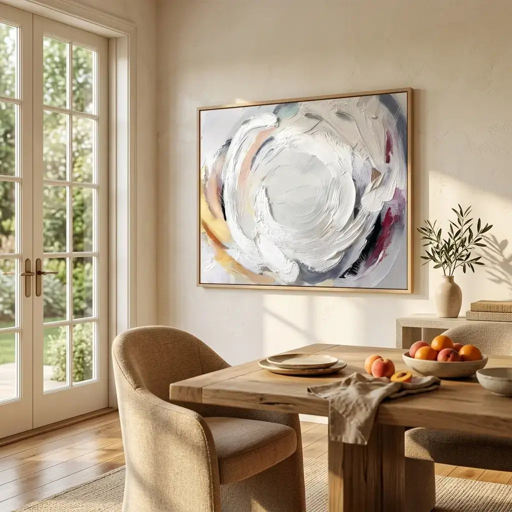 Dining room with wooden table, chairs, and abstract art on the wall.