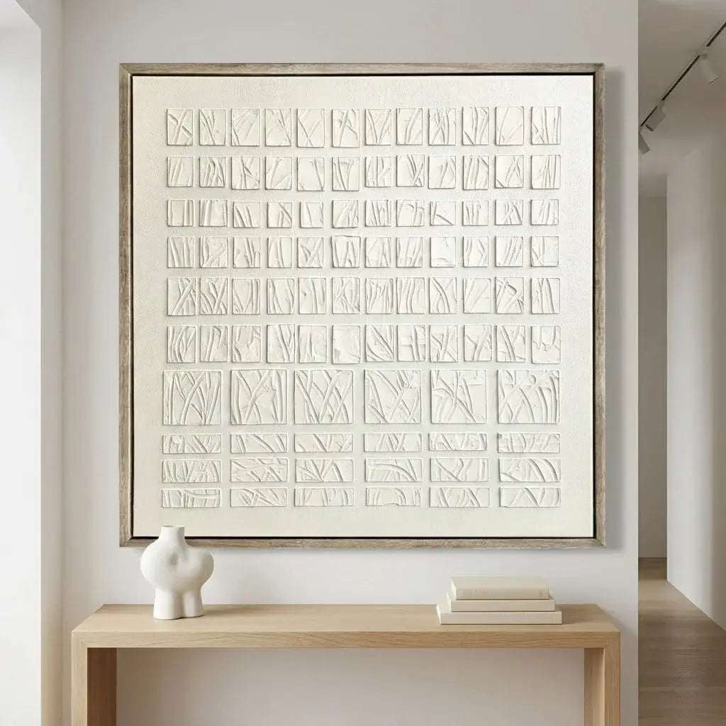 Abstract art piece on a wall with a wooden console table below