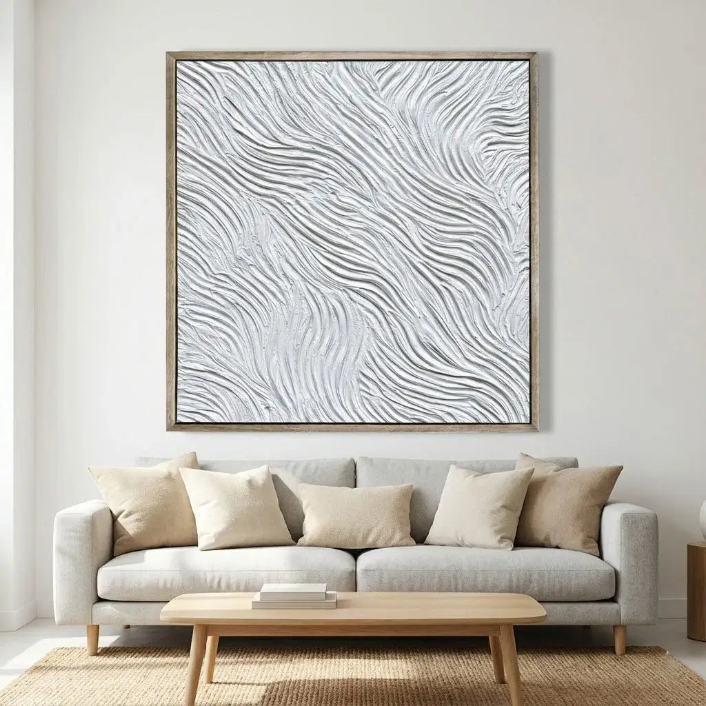 Living room with a gray sofa, wooden coffee table, and abstract wall art.