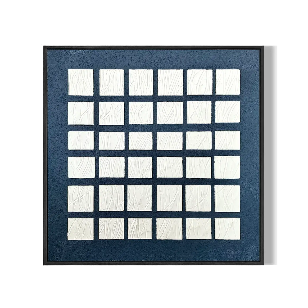 Framed artwork with a grid of white squares on a blue background