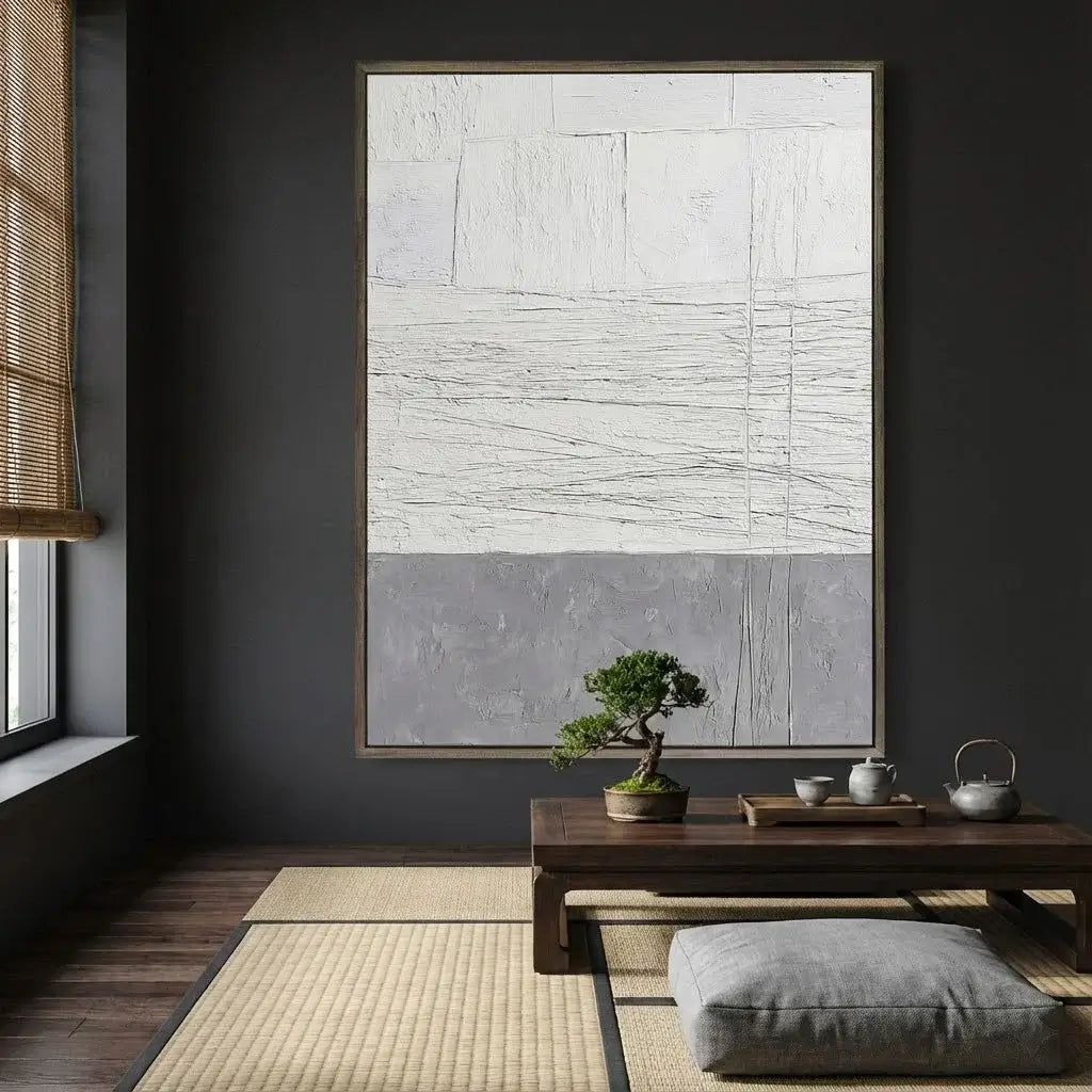 Modern interior with abstract art, bonsai tree, and wooden table.