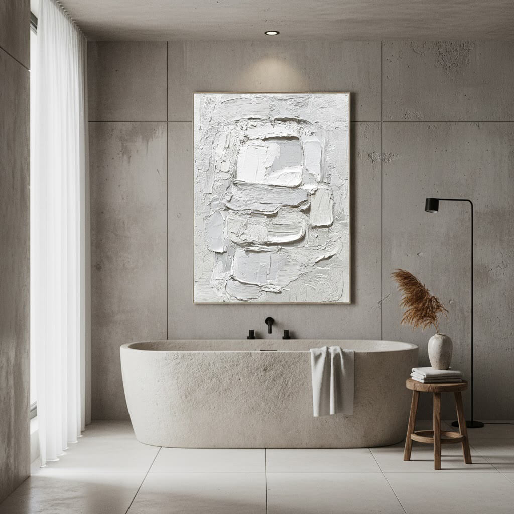 Modern bathroom with a freestanding bathtub, abstract wall art, and minimal decor.