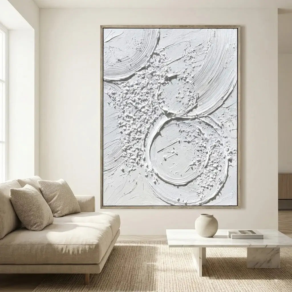 Living room with a large abstract painting on the wall, beige sofa, and coffee table.