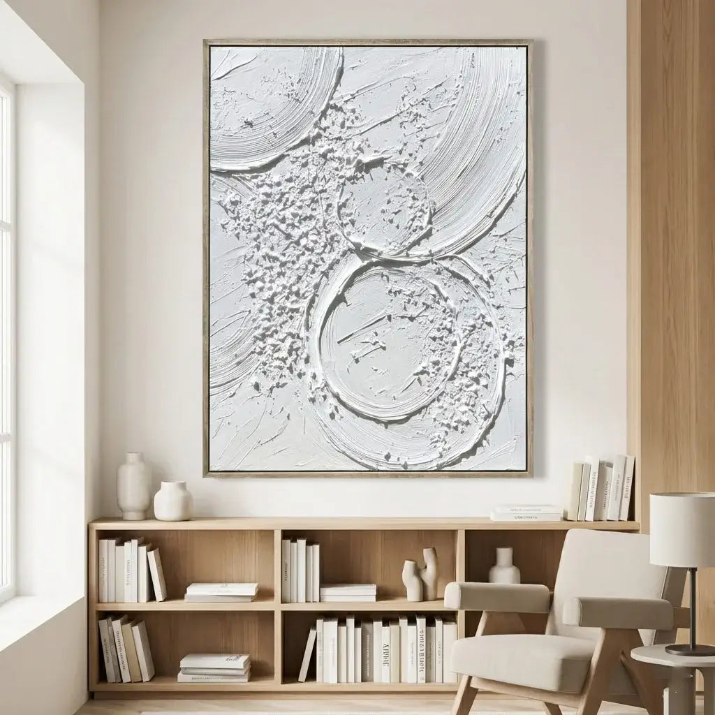 Modern interior with abstract wall art above a wooden bookshelf.