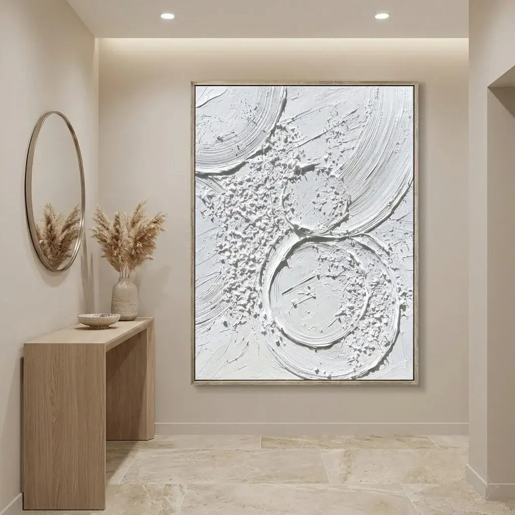 Modern interior with abstract wall art, wooden console table, and decorative plants.