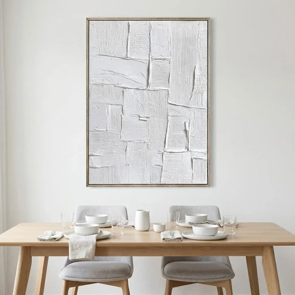 Dining room with a wooden table, chairs, and abstract art on the wall.