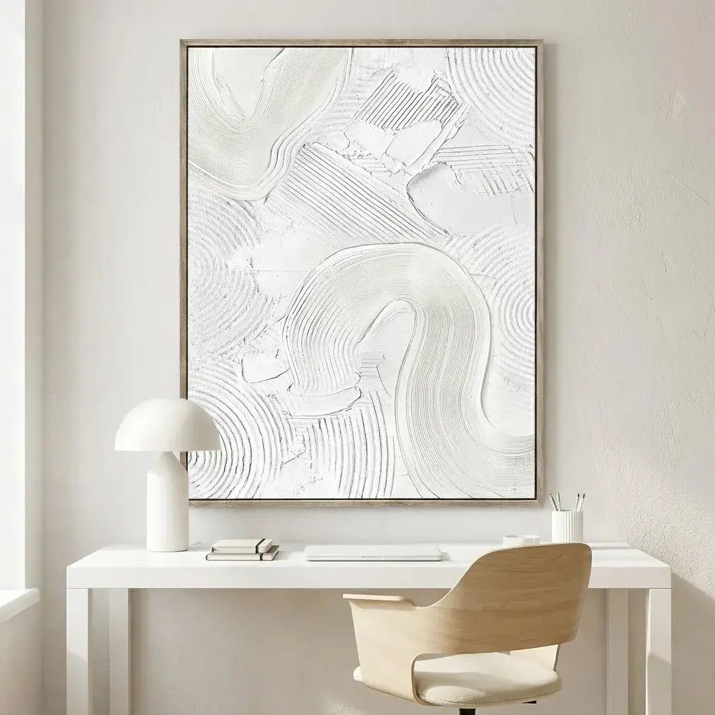 Modern office setup with a white abstract painting, desk, chair, and lamp.