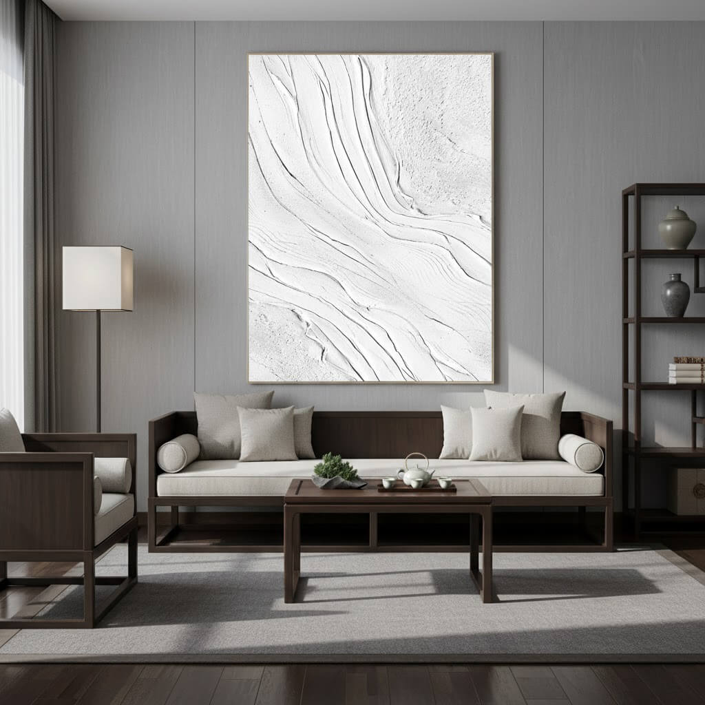 Modern living room with a gray sofa, wooden coffee table, and abstract wall art.