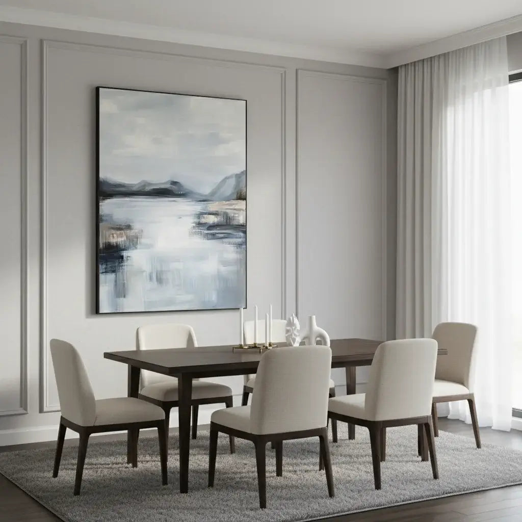 Dining room with a table and chairs against a wall with abstract art.