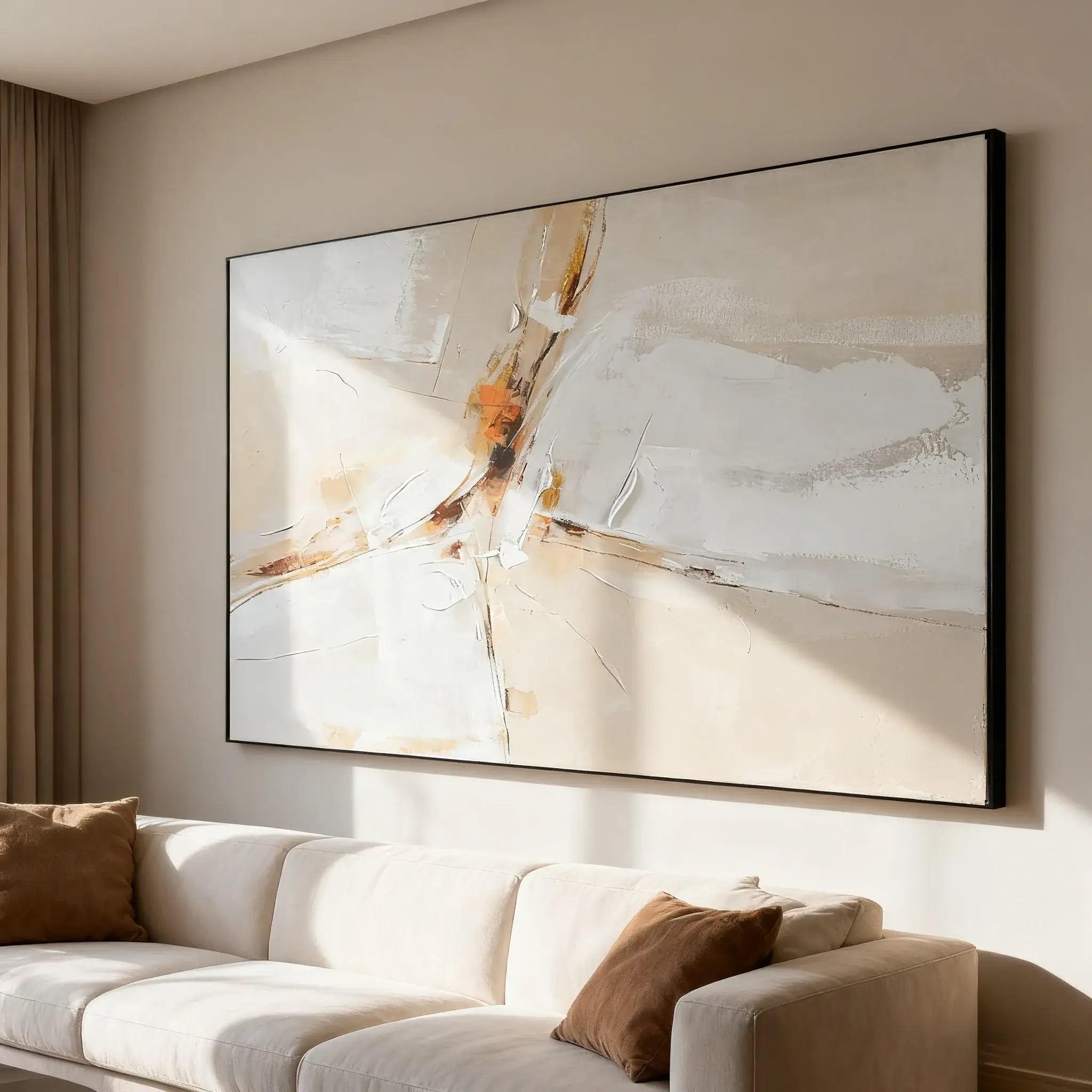 Abstract painting in a modern living room with a beige sofa and brown cushions.