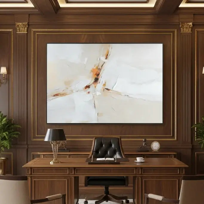 Wooden office desk with a chair in front of a large abstract painting on a wall.
