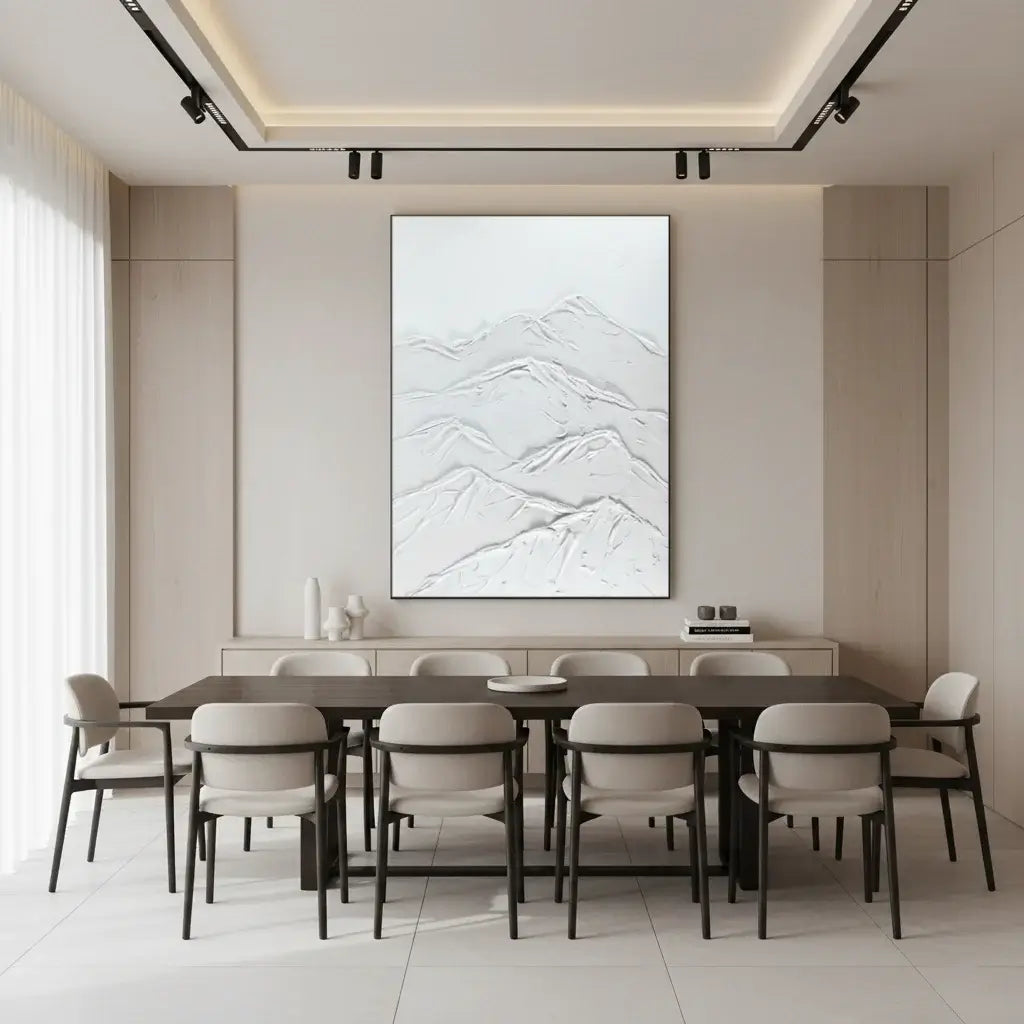 Modern dining room with a long table and chairs, featuring a marble-patterned wall art piece.