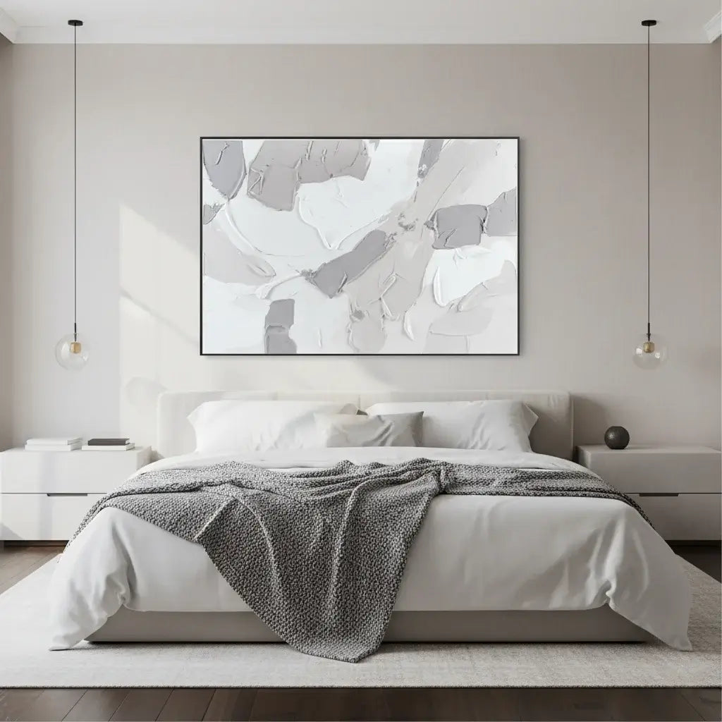 Modern bedroom with abstract art above the bed