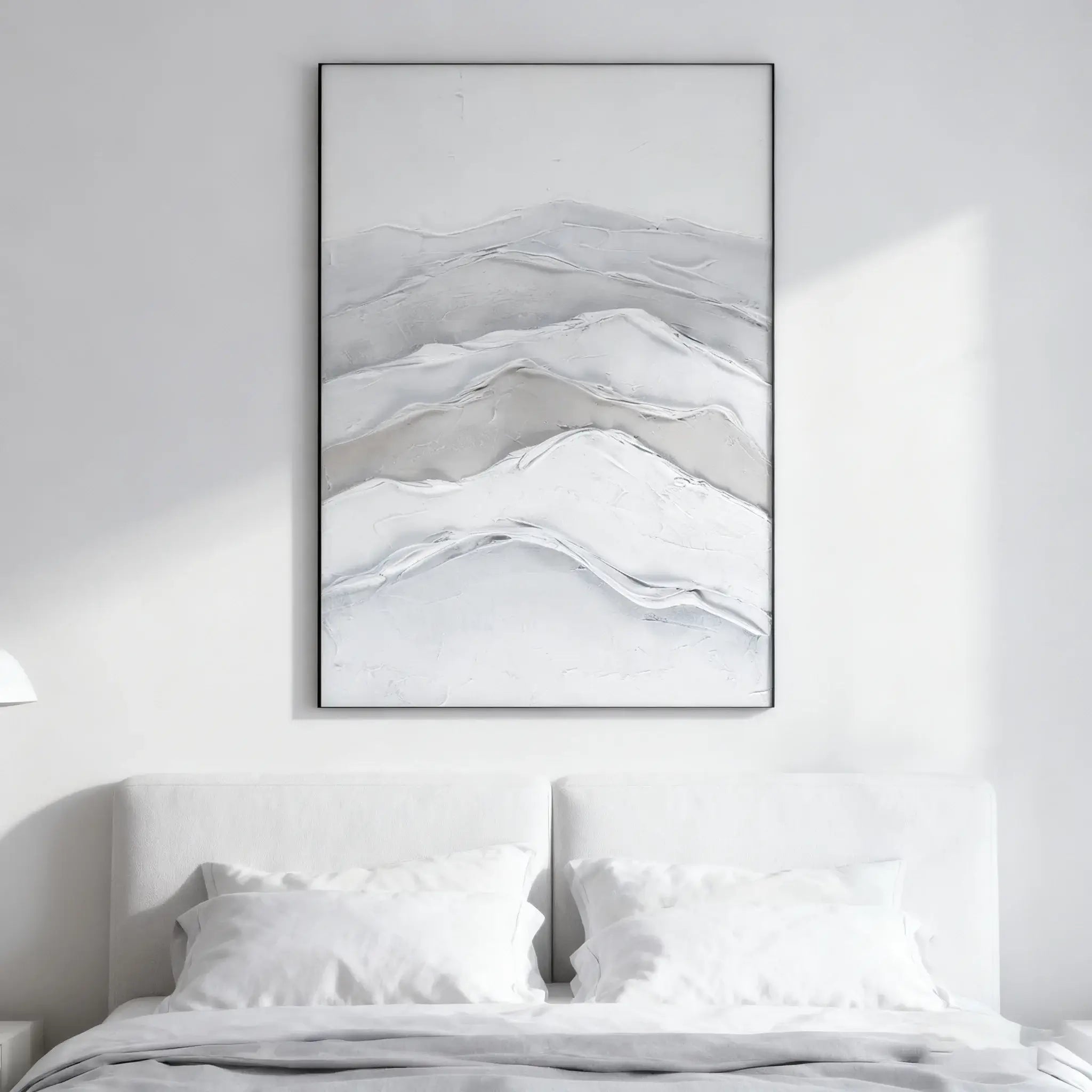Abstract mountain landscape artwork in a minimalistic bedroom setting