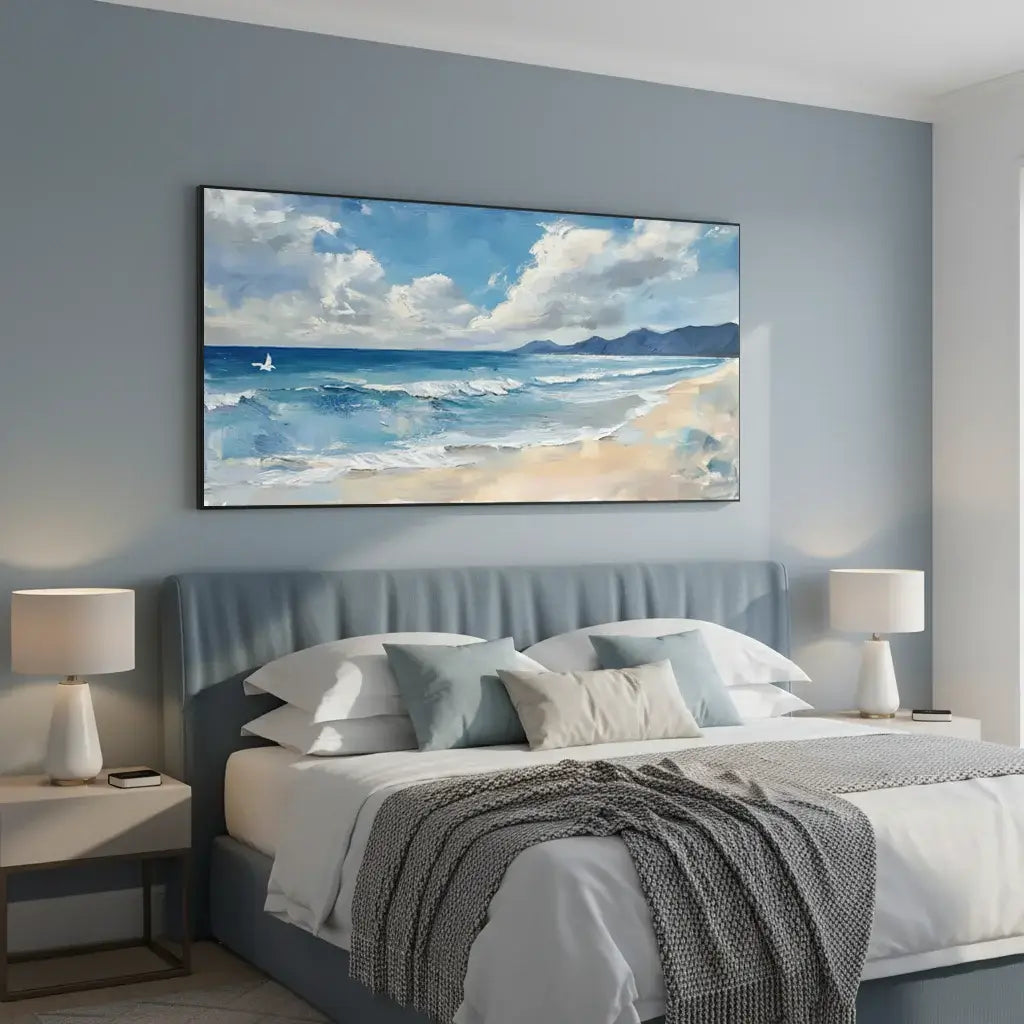 Bedroom with a large ocean painting on the wall above a bed.