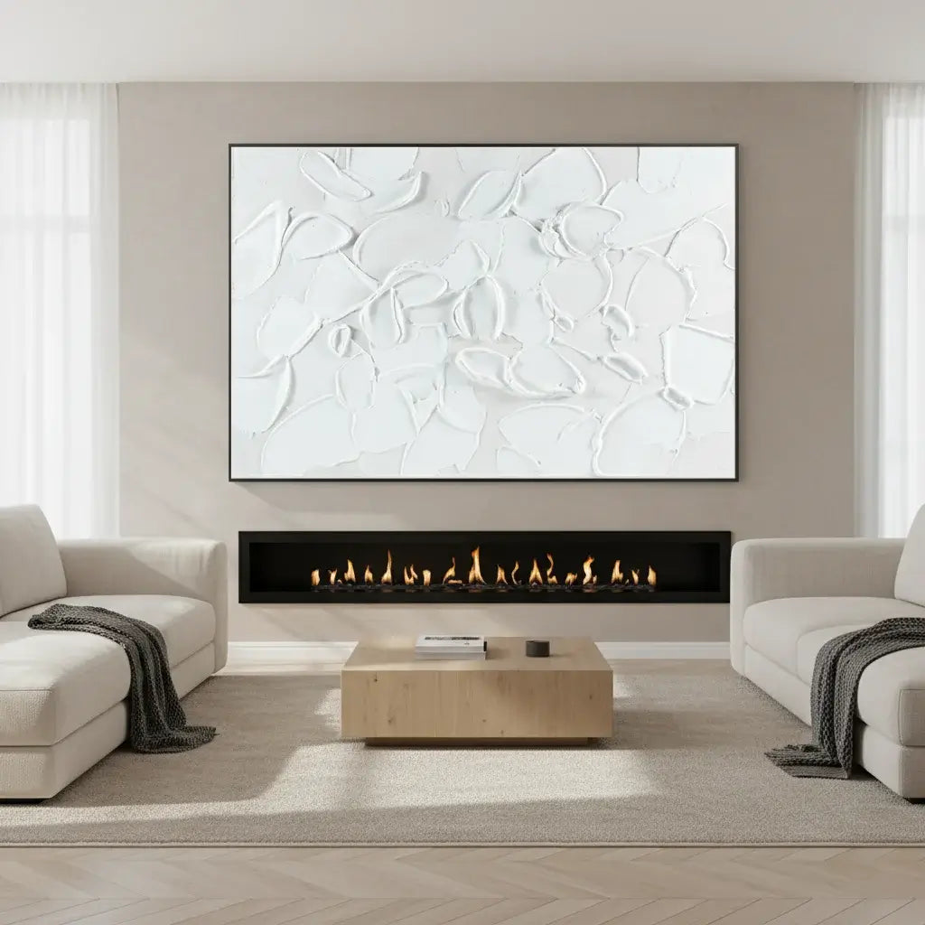 Modern living room with a fireplace, abstract artwork, and neutral decor.