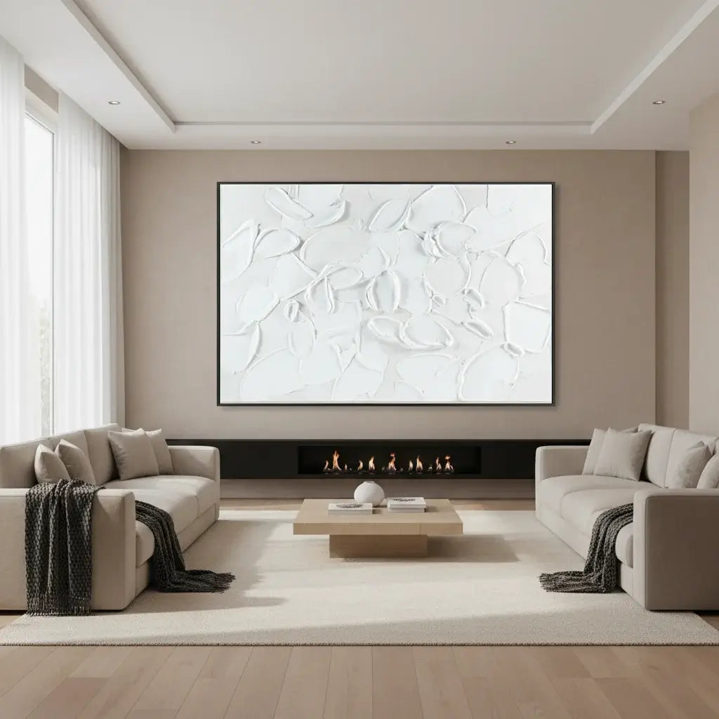 Modern living room with abstract artwork on the wall, beige sofas, and a coffee table.