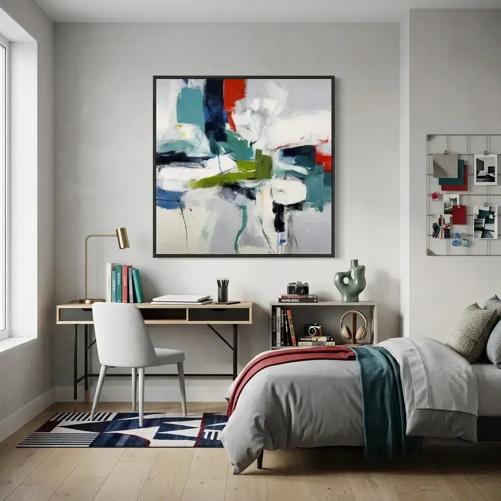 Modern bedroom with a bed, desk, and abstract artwork on the wall.