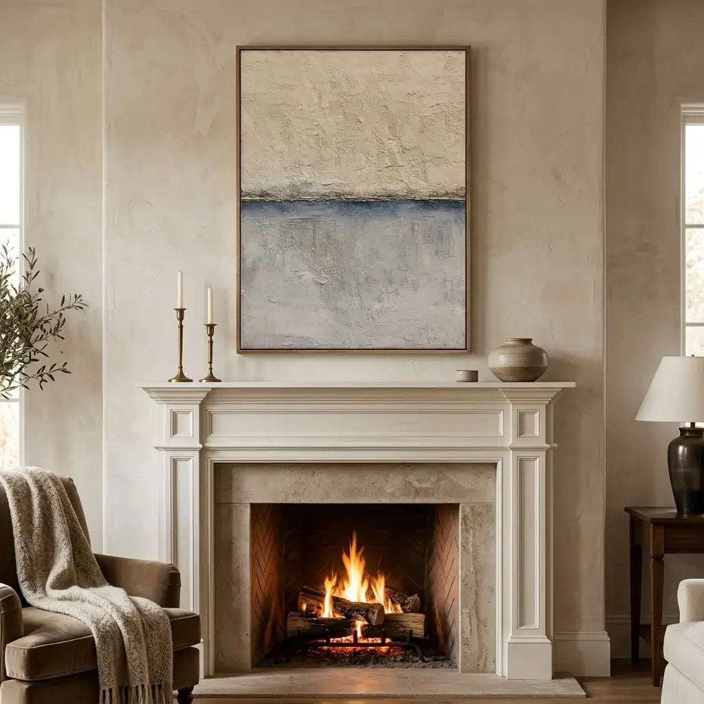 Living room with a fireplace, mantel, and abstract painting.