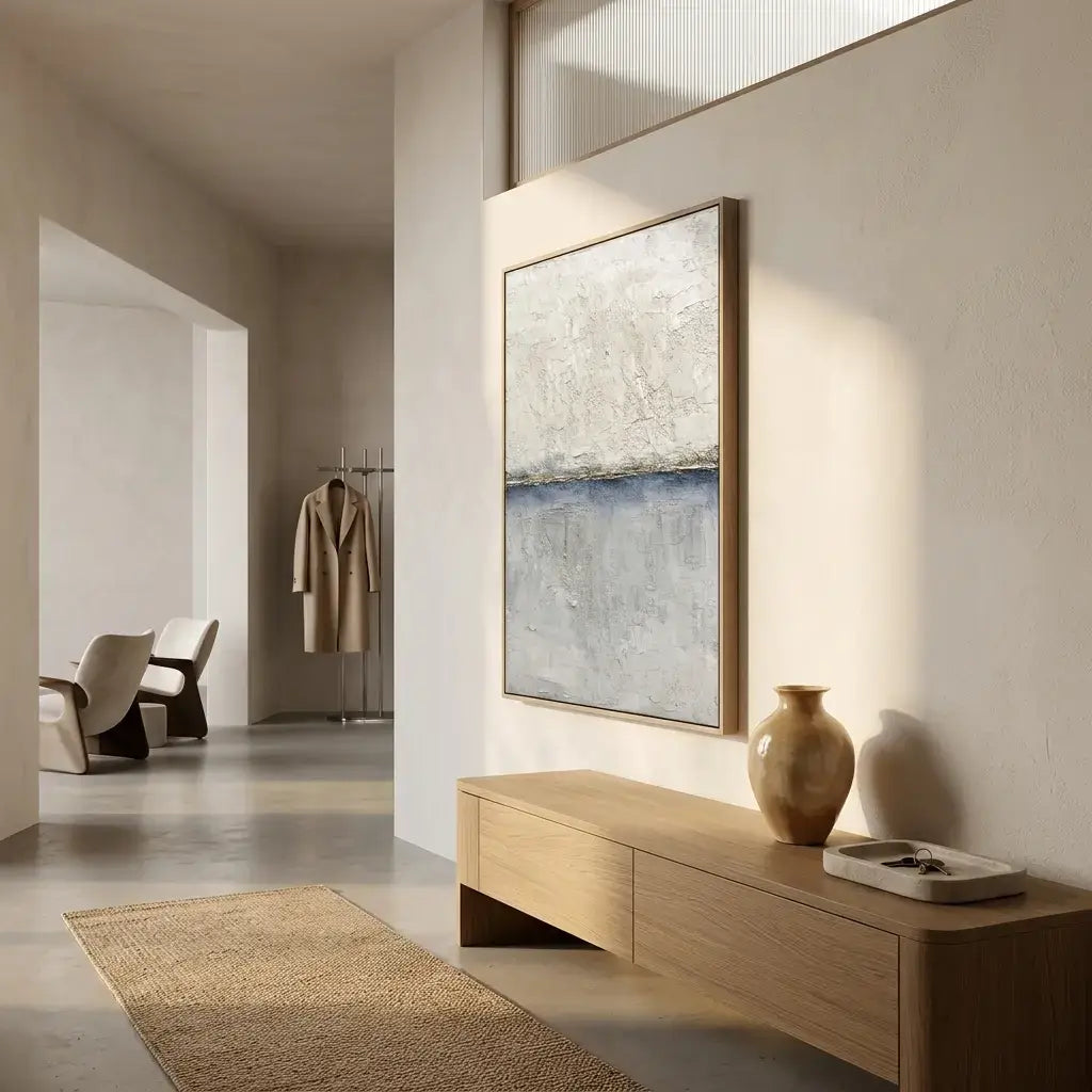 Modern interior with abstract painting, wooden cabinet, and vase.
