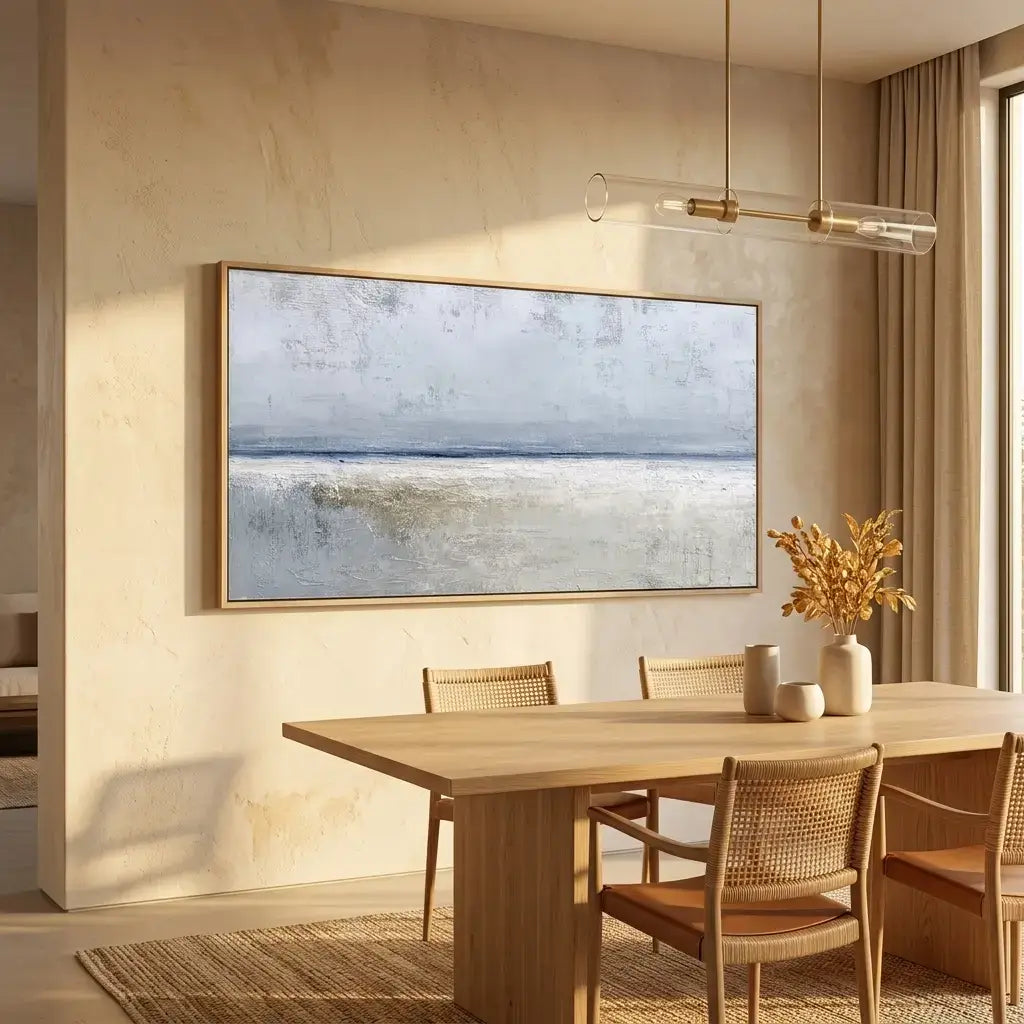 Modern dining room with a large artwork on the wall above a wooden table.