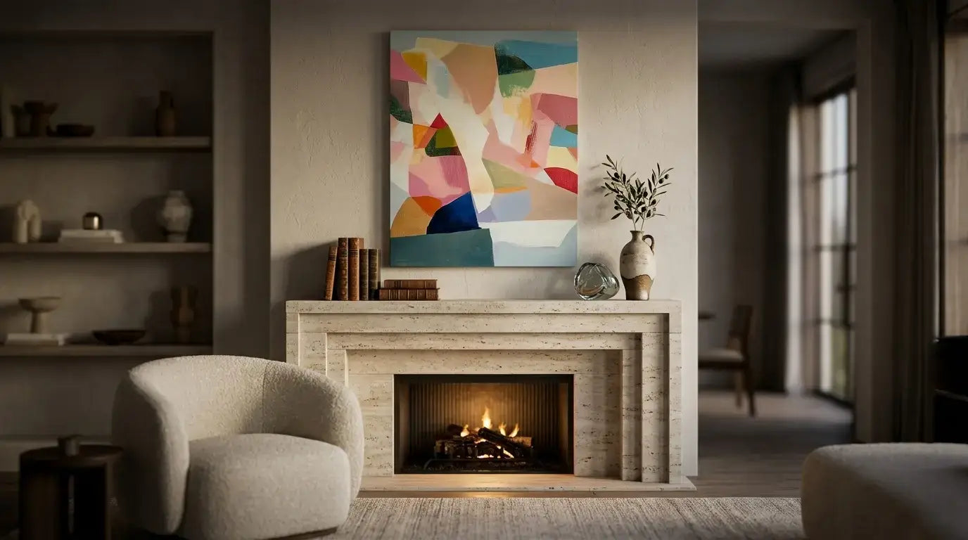 Living room with a fireplace, armchair, and abstract painting.