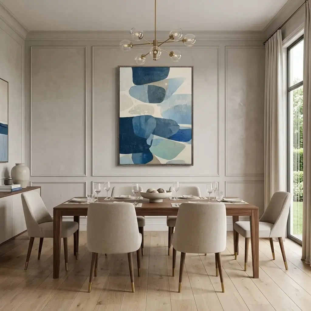 Dining room with a wooden table and chairs, abstract art on the wall, and large windows.