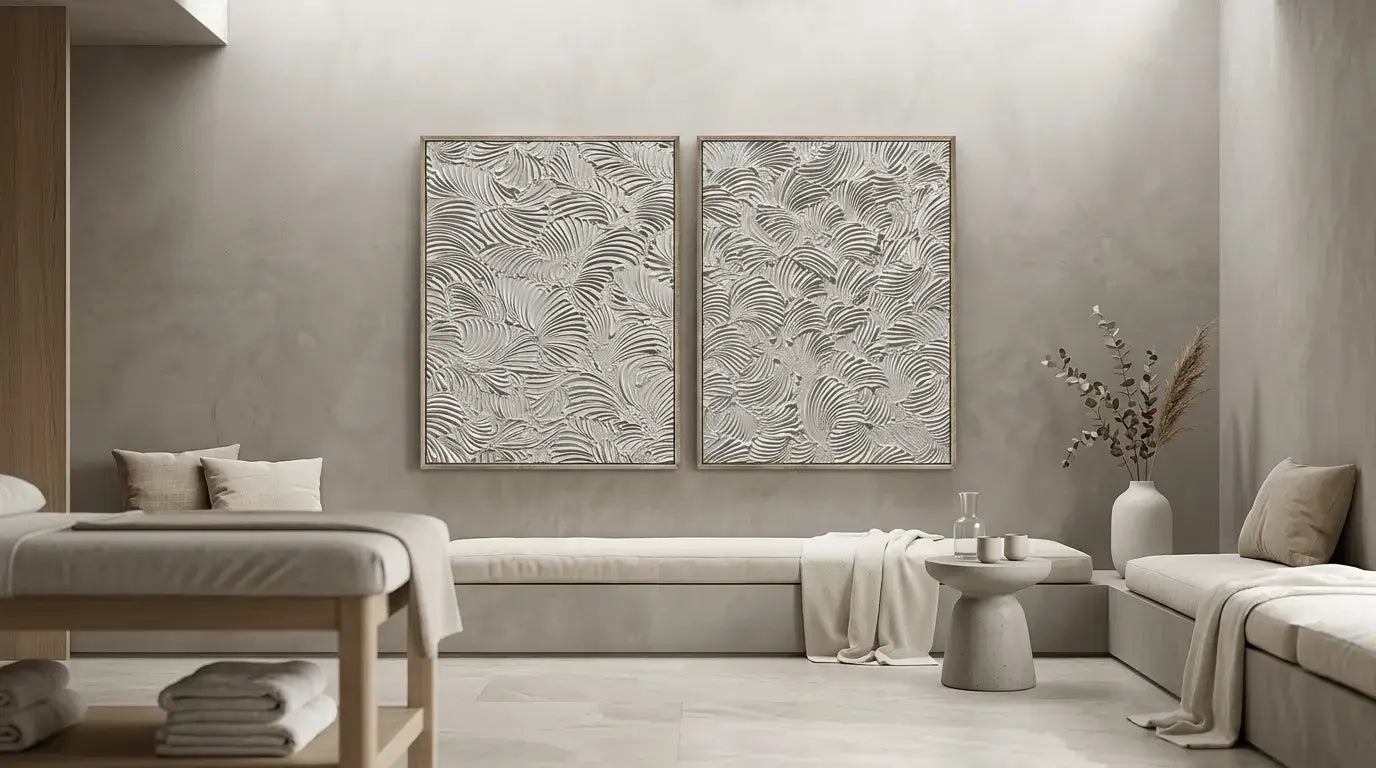 Modern living room with two abstract wall art pieces on a neutral wall.