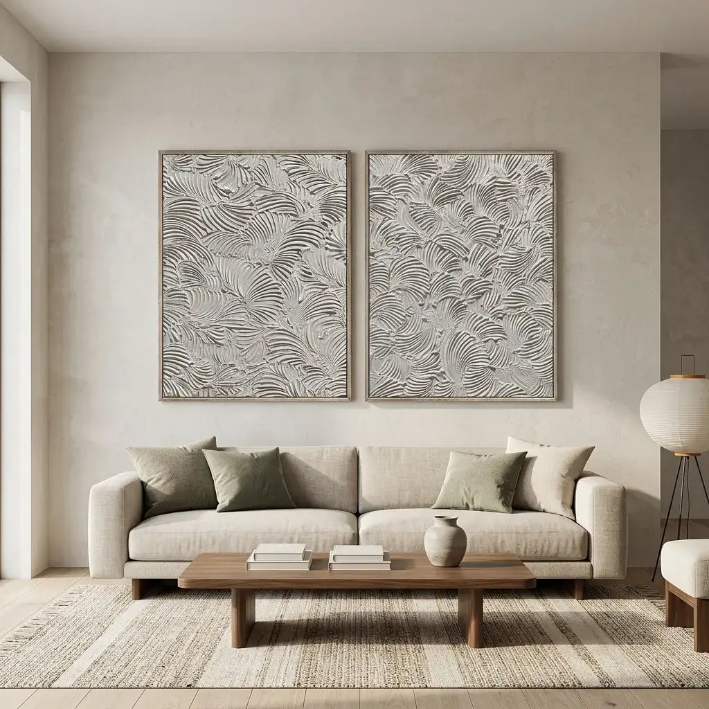 Living room with a beige sofa, wooden coffee table, and two abstract wall art pieces.