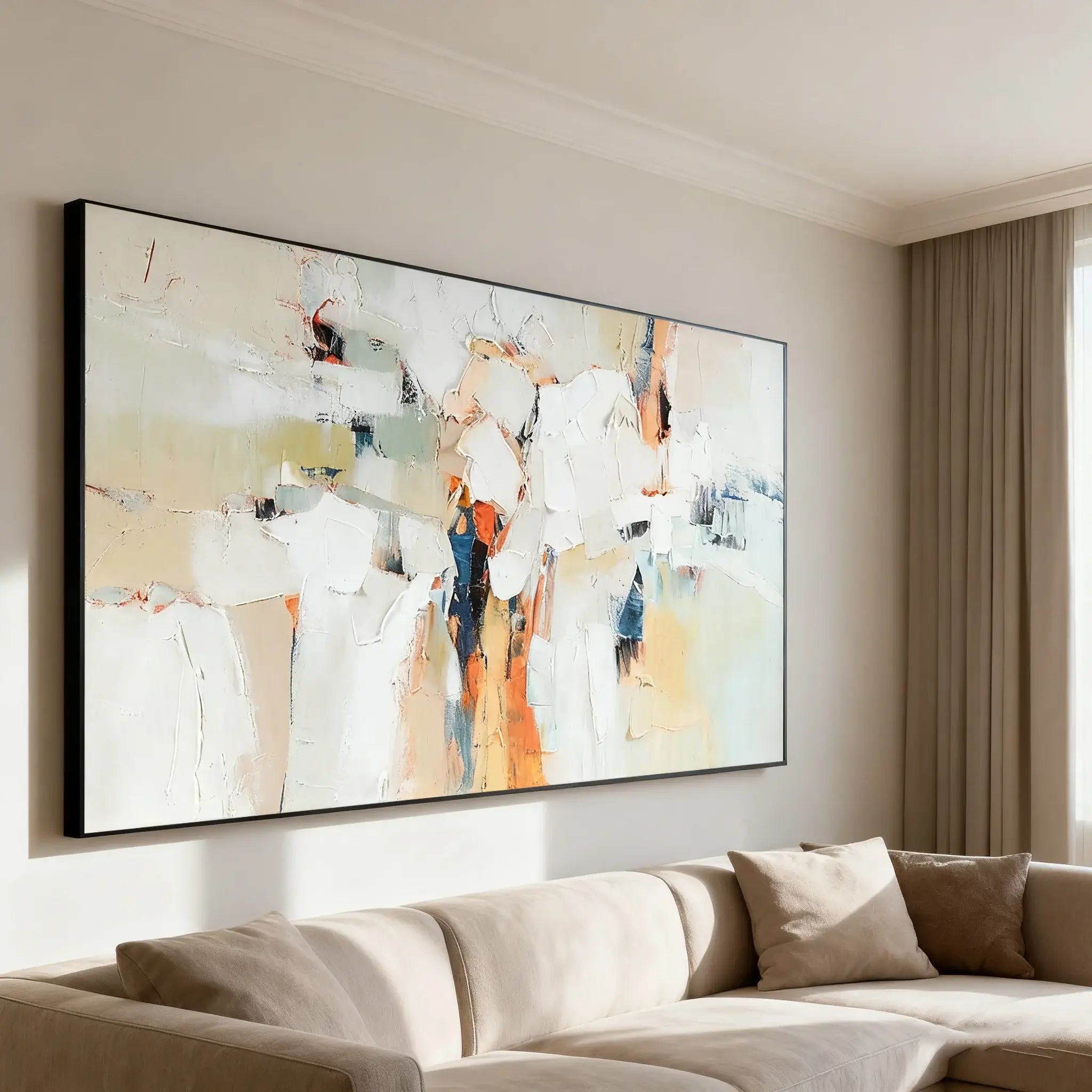 Abstract art painting on a wall above a beige sofa in a living room.