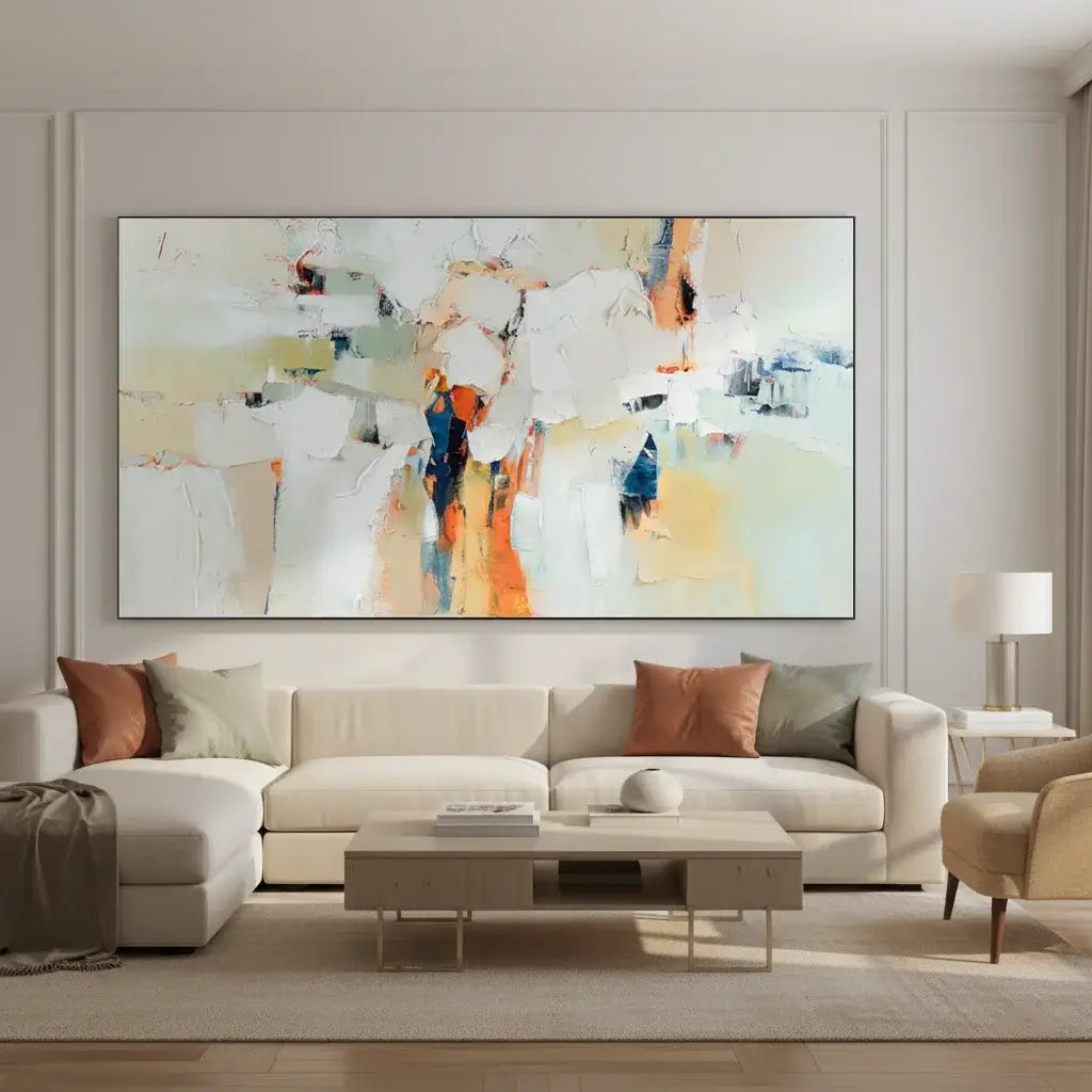 Modern living room with a large abstract painting on the wall above a beige sofa.