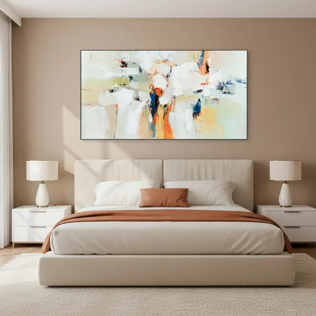 Modern bedroom with a bed, nightstands, and abstract wall art.