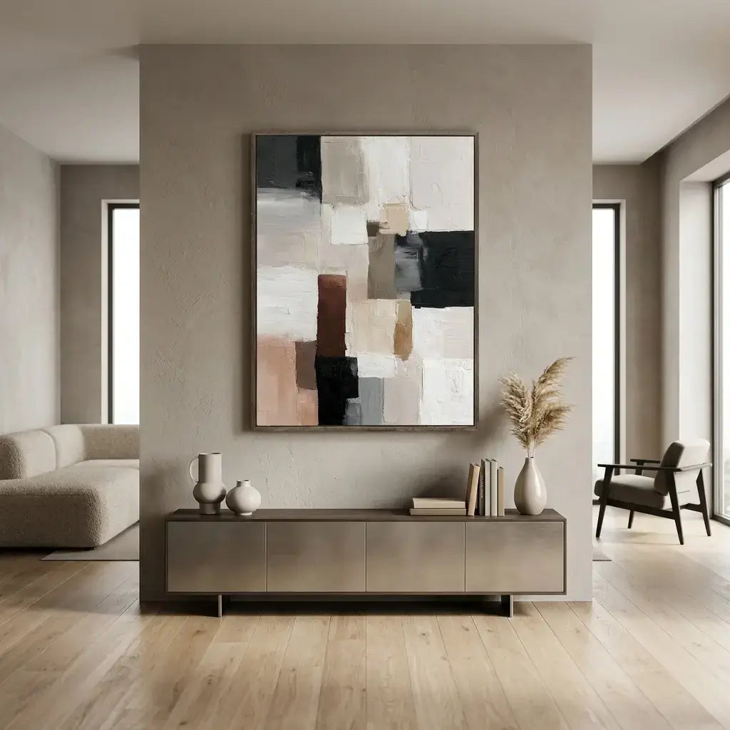Modern living room with abstract art on the wall and decorative items on a console table.