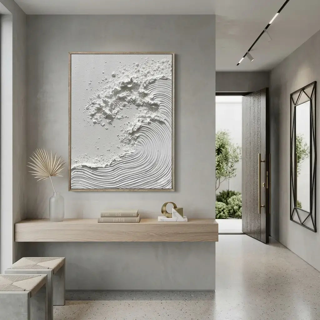 Modern interior with a textured wall art piece, wooden shelf, and open door leading to a garden.