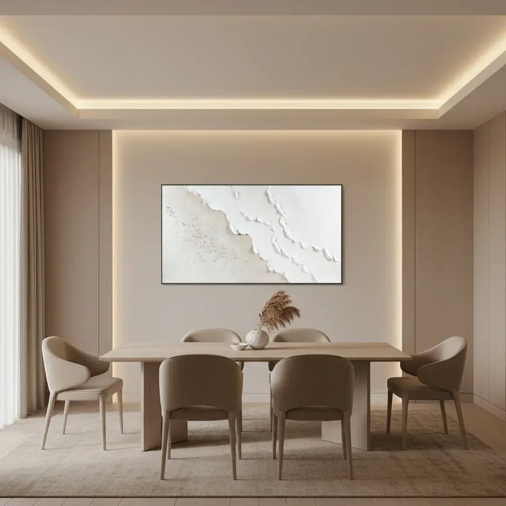Modern dining room with a beige table and chairs, abstract art on the wall, and soft lighting.
