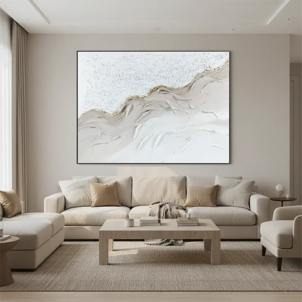 Modern living room with a beige sectional sofa, abstract wall art, and a coffee table.