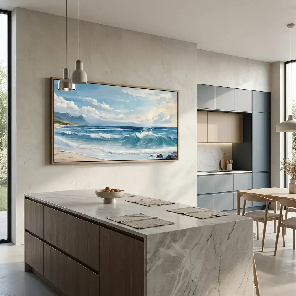 Modern kitchen with a large TV displaying an ocean scene, marble island, and dining area.