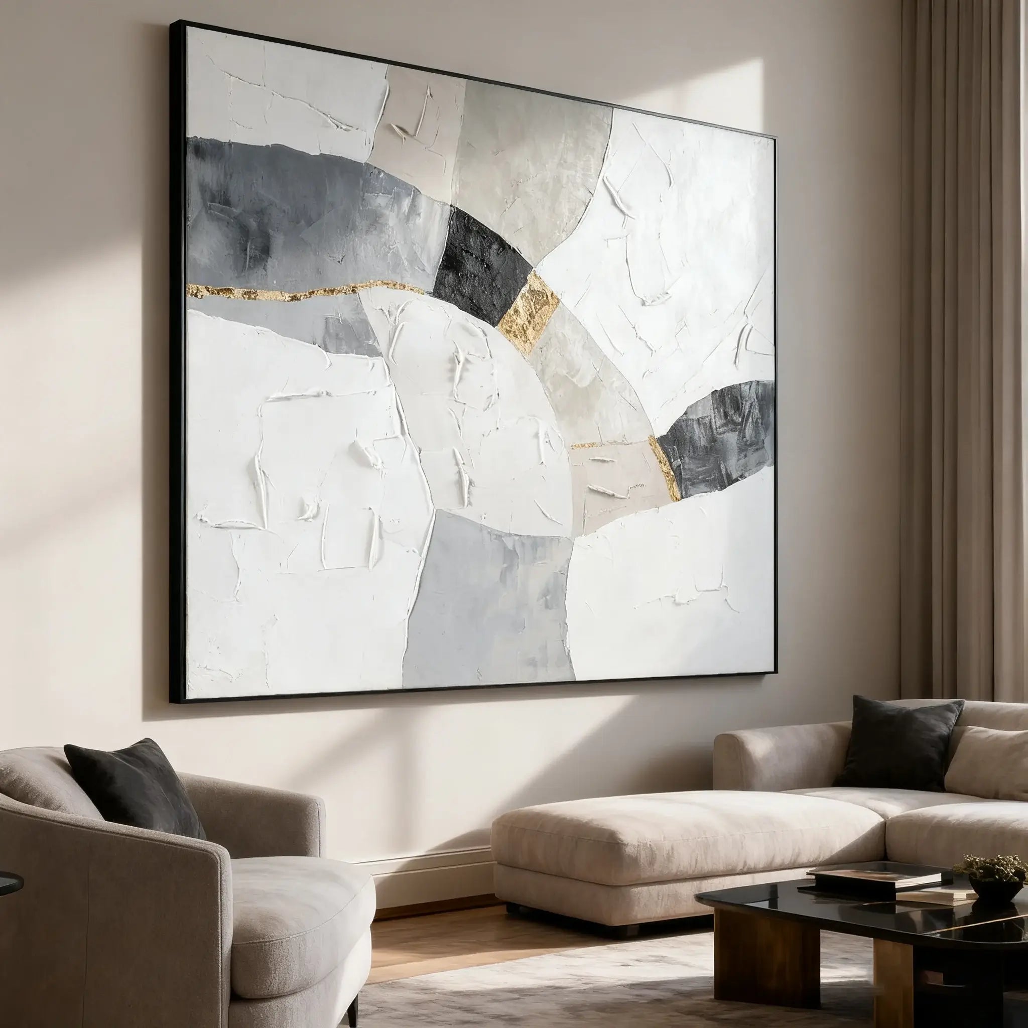 Abstract art piece on a wall in a living room with a sofa and coffee table.